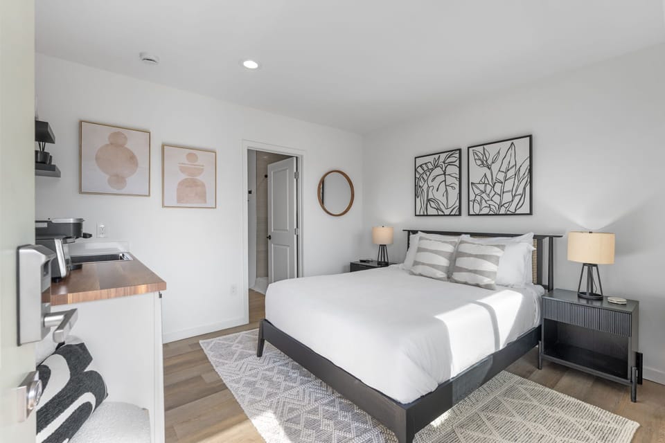 This modern, well equipped kitchenette with a small fridge, microwave, toaster oven/air fryer combo, and Keurig coffee maker -perfect for effortless meals and morning coffee.