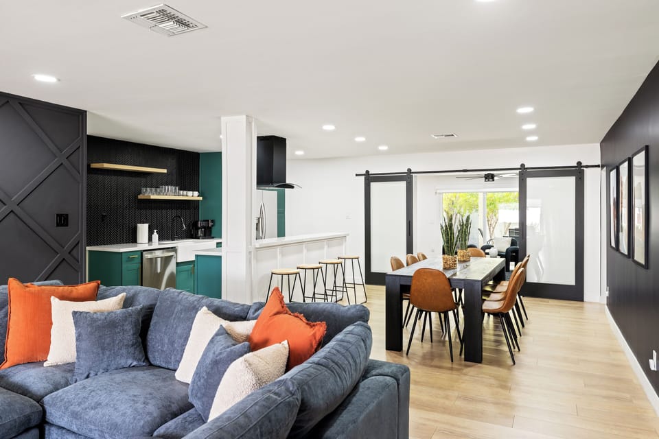 Where modern design meets cozy comfort. Gather around the table, cook in style, and unwind in this beautifully curated open-concept retreat.