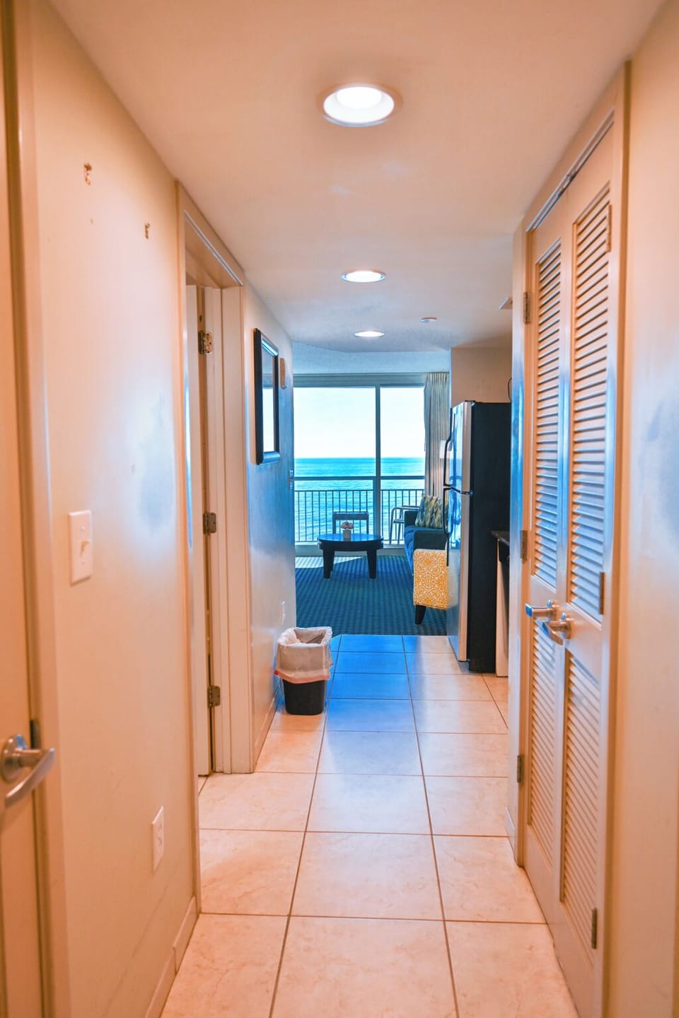 Bright and spacious resort condo entryway that leads to oceanfront views.