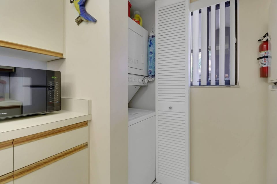 A stackable washer and dryer in the kitchen is provided for your complimentary use.
