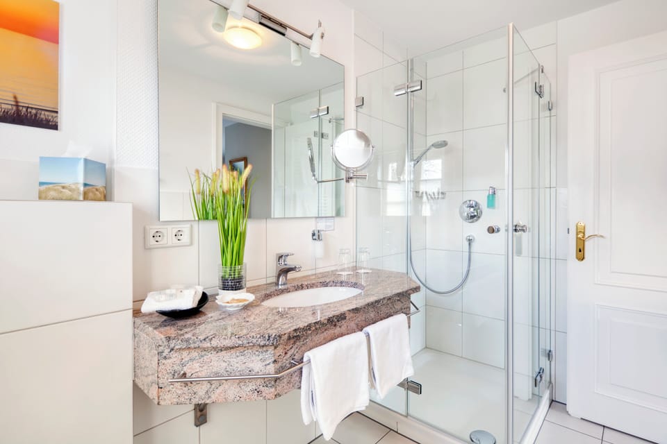 Double Room | Bathroom | Shower, hair dryer, slippers, towels