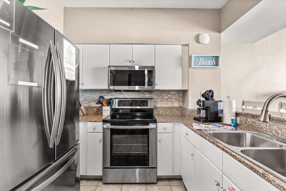 Modern kitchen with stainless steel appliances, granite counters, and everything you need to cook in comfort.