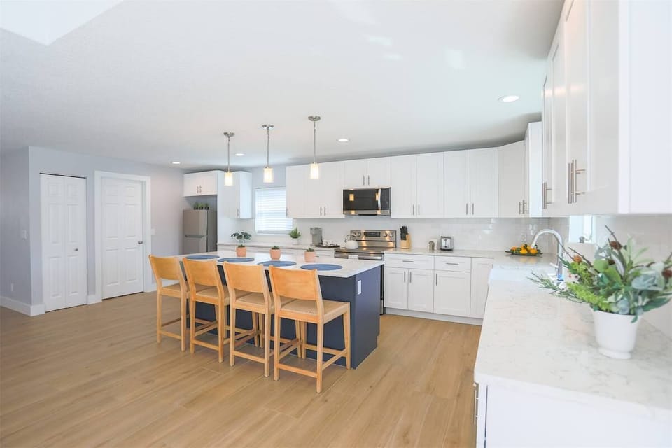 Fully equipped with stainless steel appliances, sleek countertops, and everything needed for home-cooked meals.