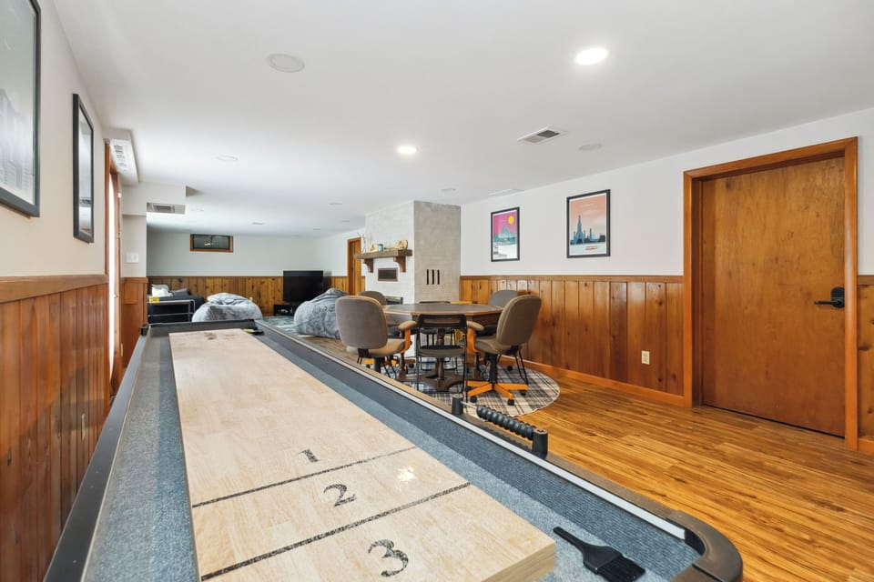 Basement game room with shuffleboard
