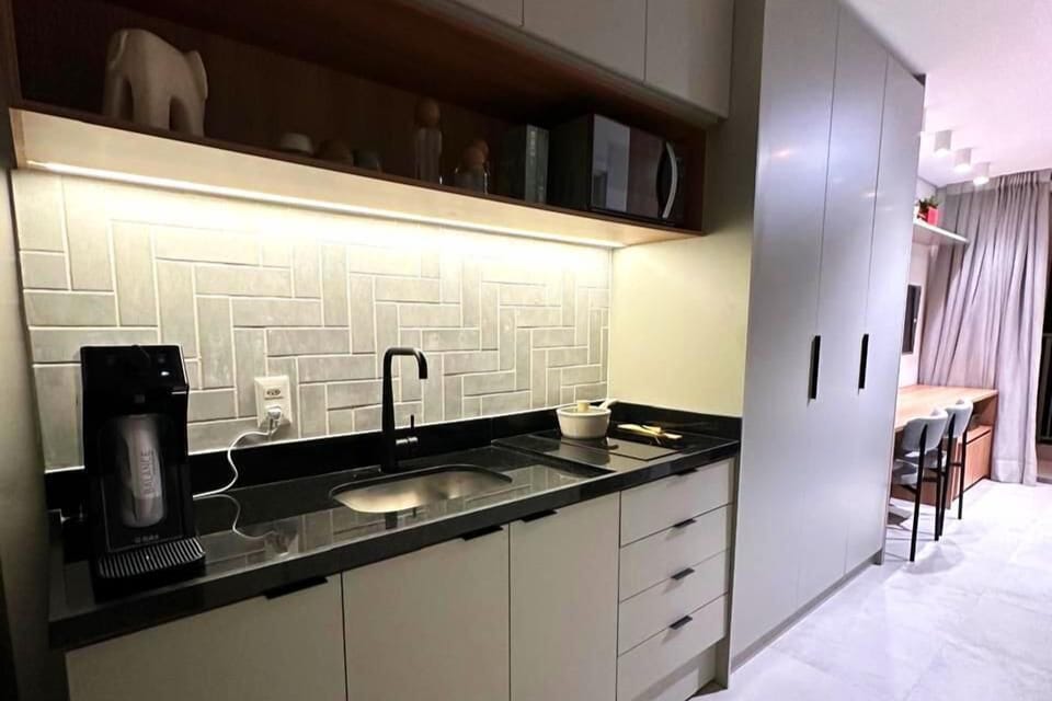 Deluxe Studio Suite, Balcony, Pool View | Private kitchen | Full-size fridge, microwave, oven, stovetop
