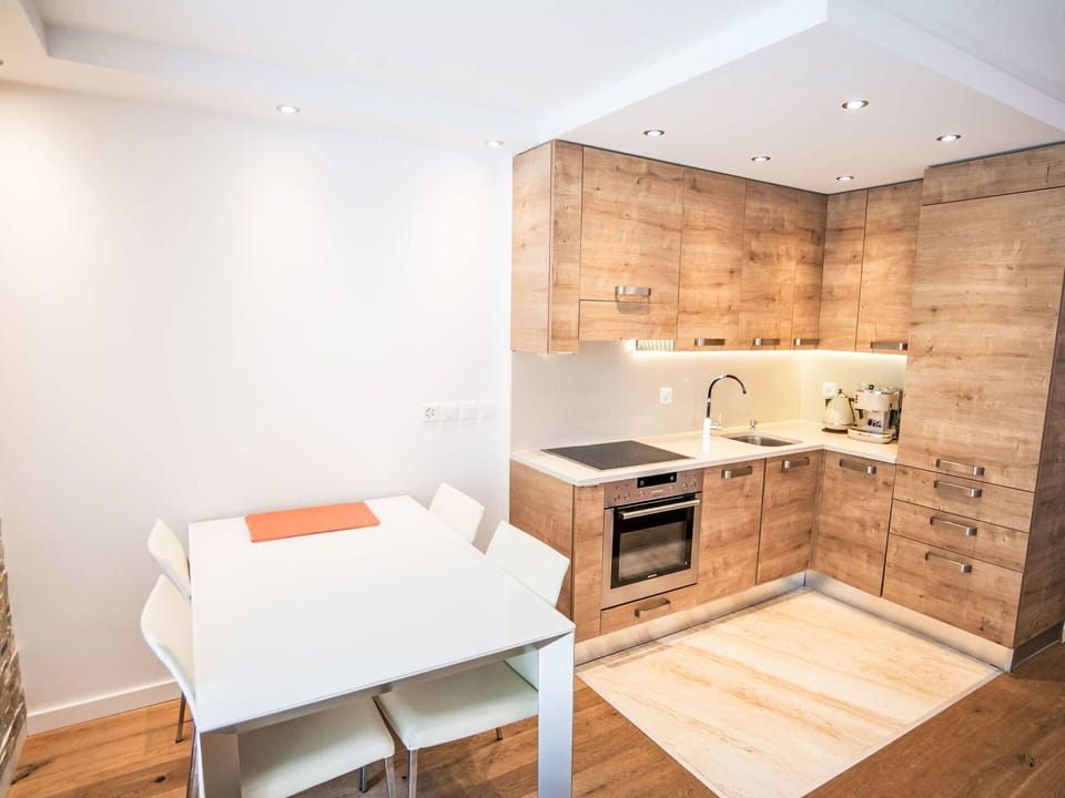 Furniture, Flooring, Kitchen, Countertop, Interior Design, Cabinetry, Wood, Floor, Kitchen Appliance, Wood Flooring