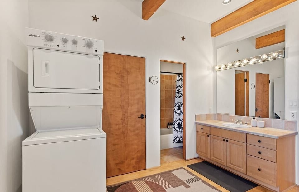Ensuite guest bathroom that also connects with the living space. W/D located in this bathroom as well.