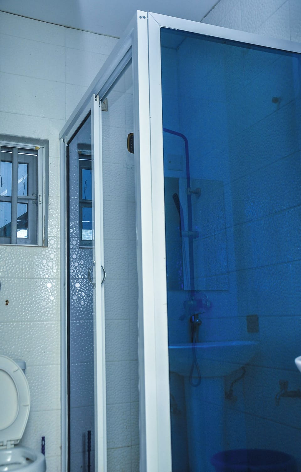 Shower, slippers, towels, soap