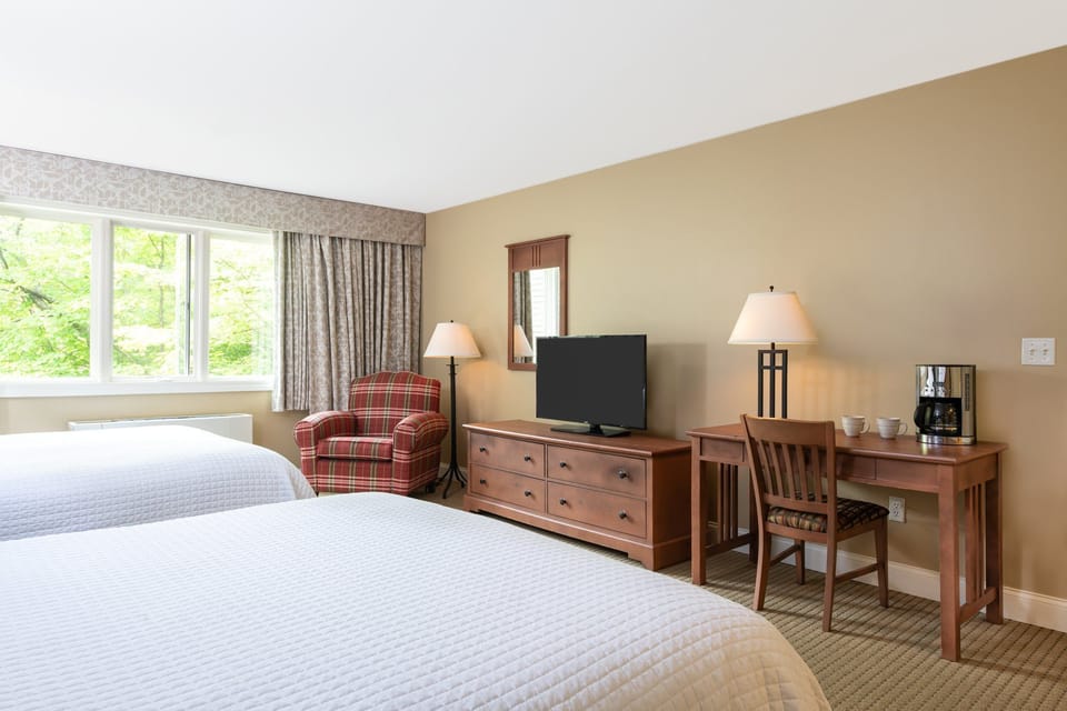 Well-lit bedroom with a serene view, providing a calm and peaceful retreat.