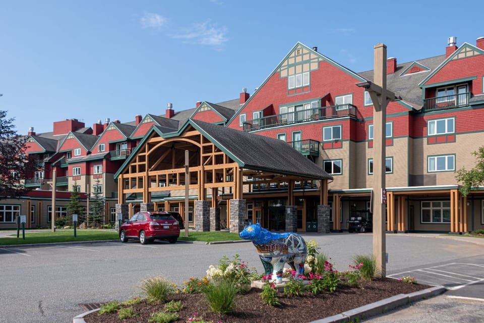 A grand welcome awaits—where rustic charm meets modern comfort for an unforgettable stay.