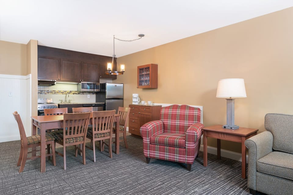 Enjoy a home-cooked meal or gather for conversation in the spacious dining and living area, complete with a warm and inviting atmosphere.