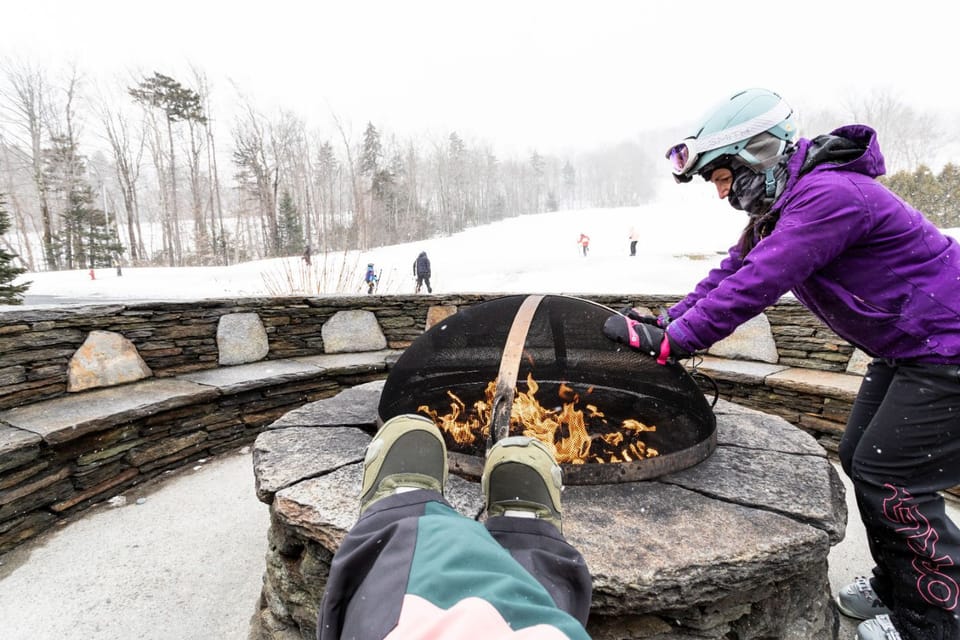 Unwind after a day on the slopes with a fireside moment, where crisp mountain air meets the warmth of a crackling flame.