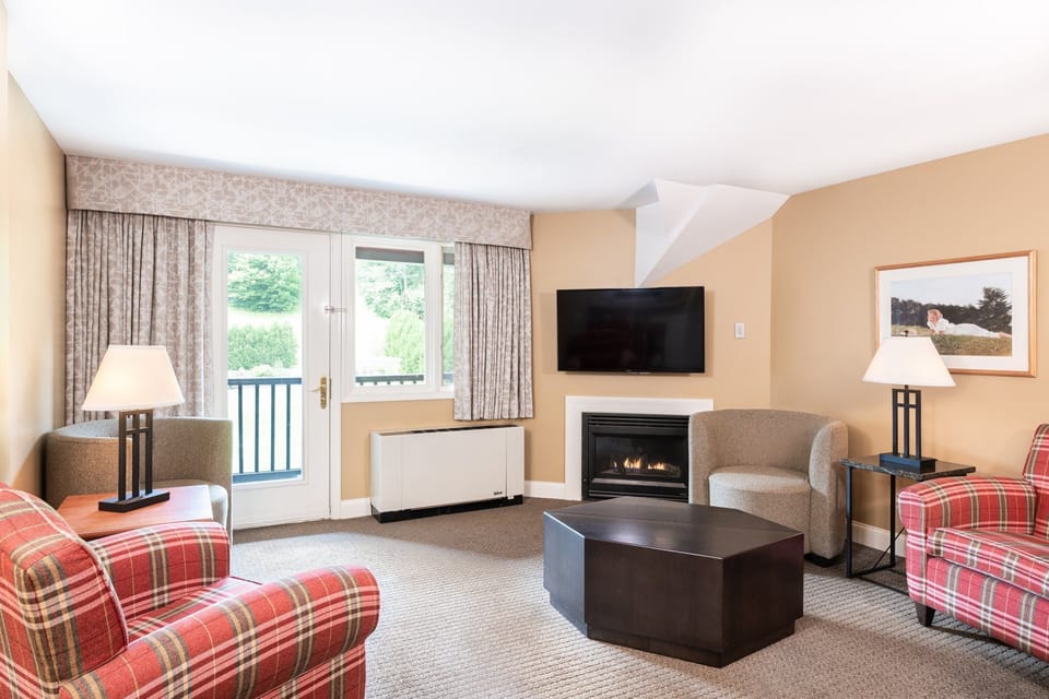 Welcoming living room featuring a fireplace and warm decor, providing a perfect spot for relaxation and conversation.