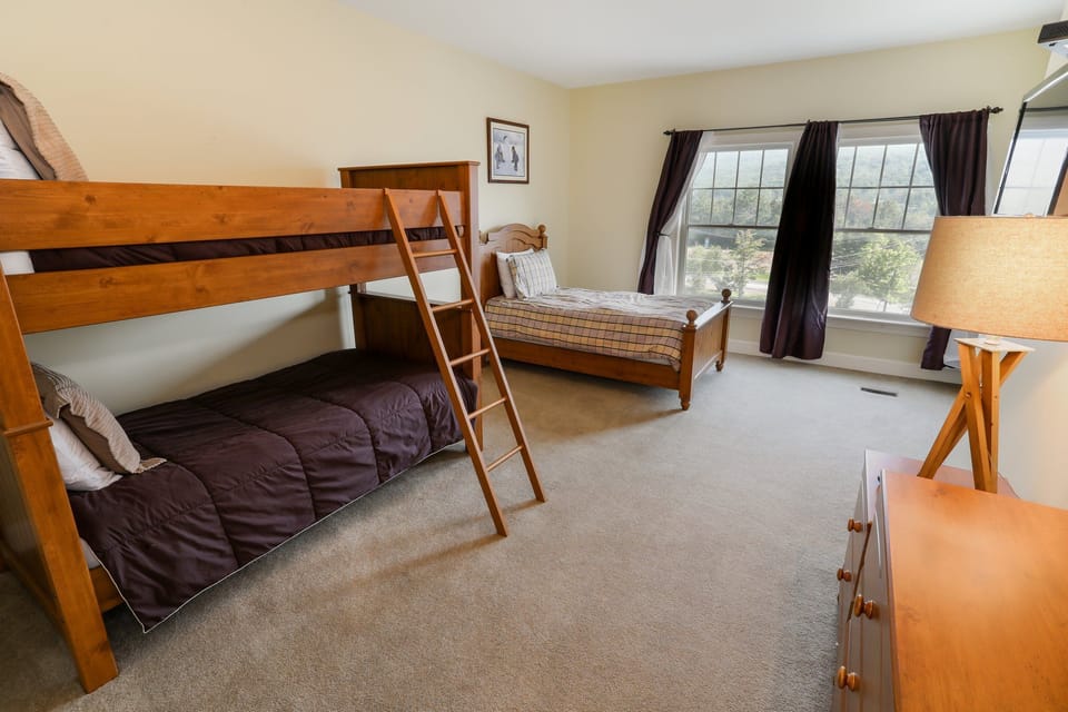 Bunk room with twin-over-full beds, providing plenty of sleeping space for larger groups or families.