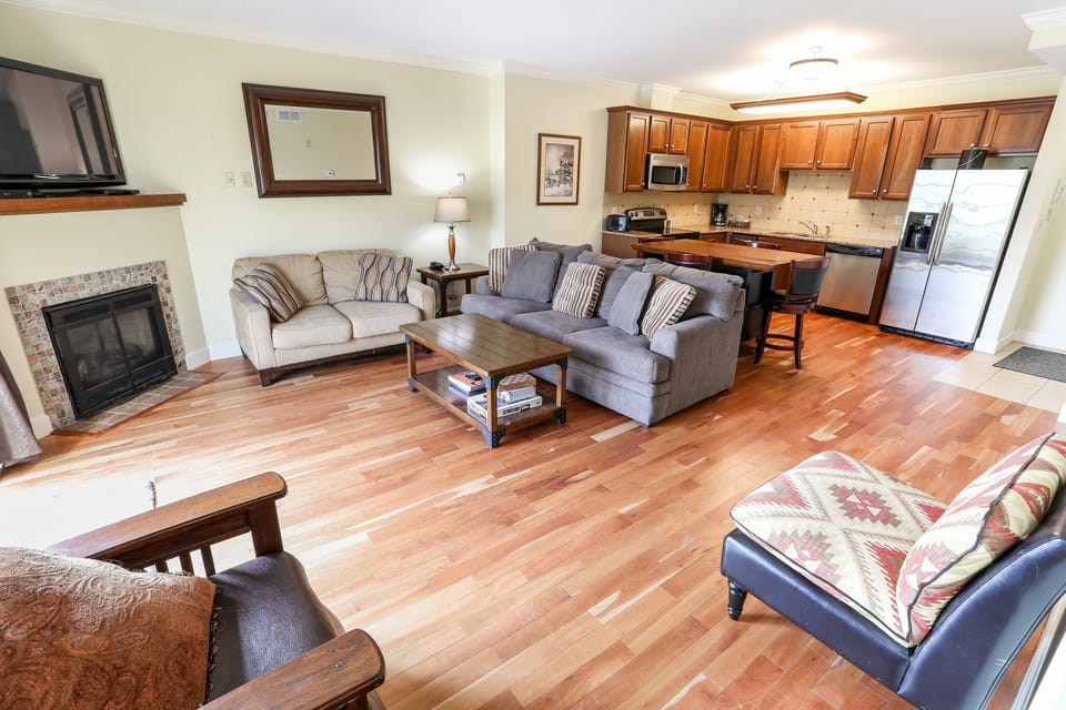 Open-concept living space with plenty of seating, connecting the living area and kitchen for easy socializing.
