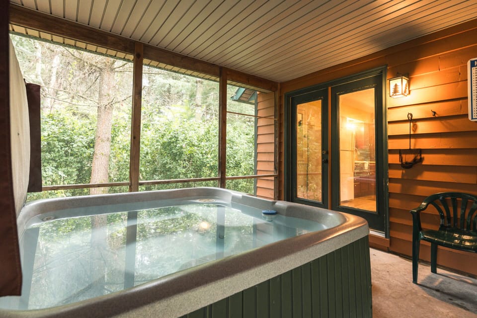Hot Tub in covered screened in porch