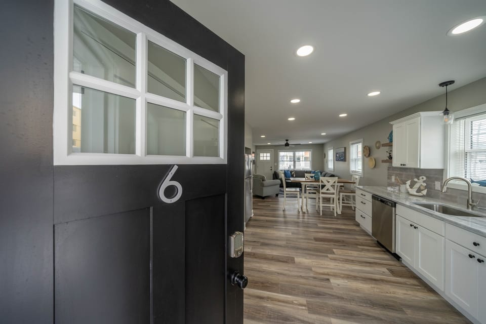 Step into Unit 6 and enjoy an open, light-filled layout with coastal accents, modern kitchen, and inviting lounge space. A perfect blend of comfort and style for your beachside stay.