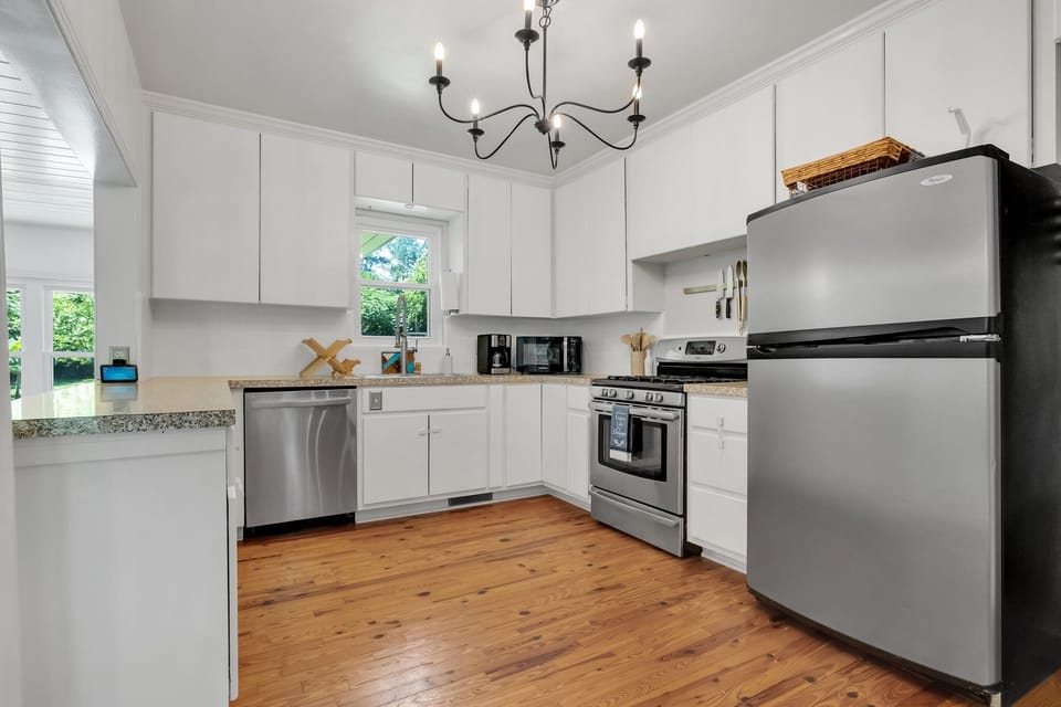 Roomy kitchen with plenty of kitchenware and utensils

