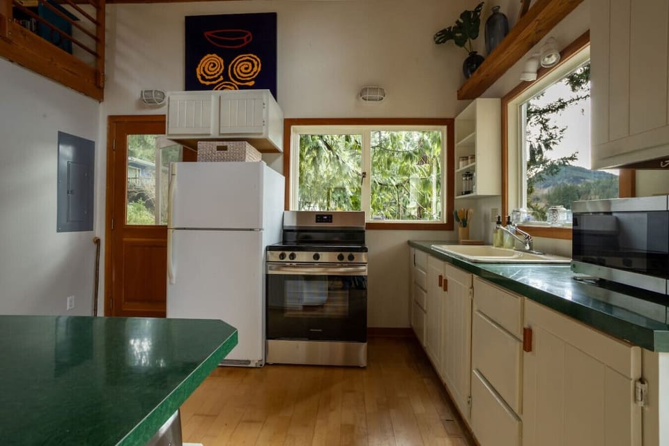 The kitchen has a full size refrigerator and stove and a microwave. Everything is stocked in the kitchen that you would need. Bring your food and you will be set!