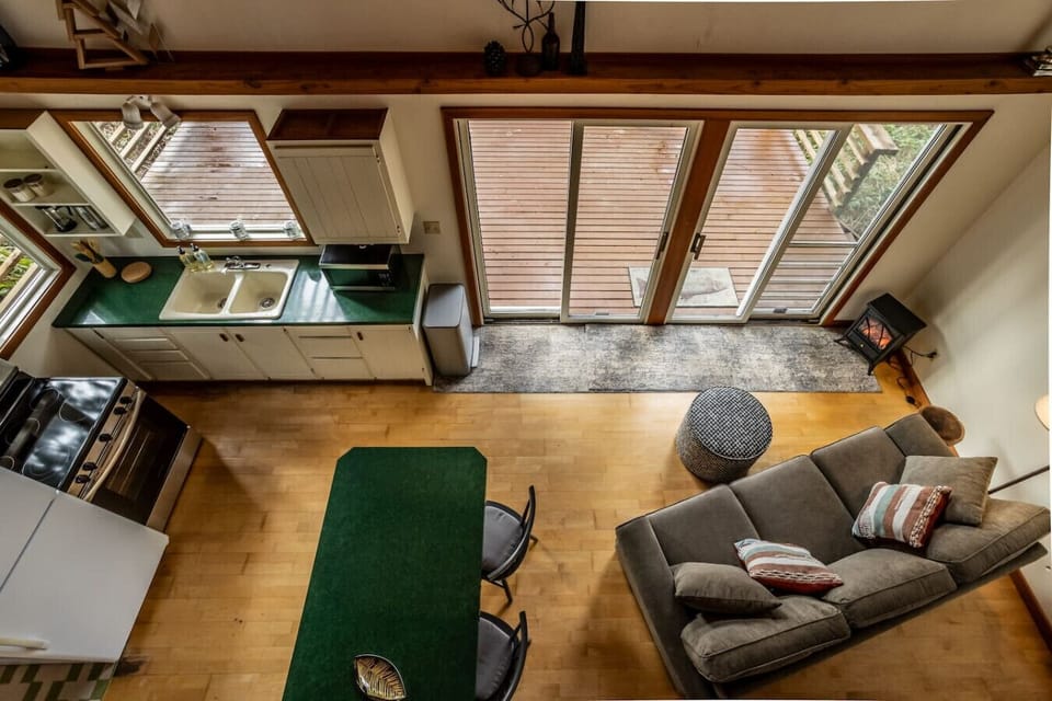 Looking down from the loft into the living space down belo