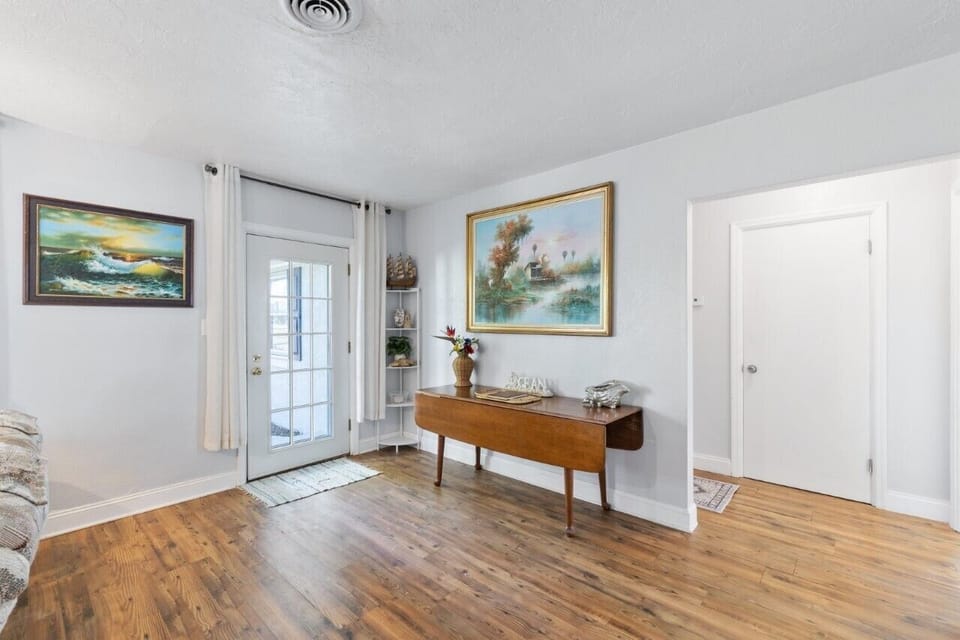 Entry space with beautiful coastal artwork and decor


