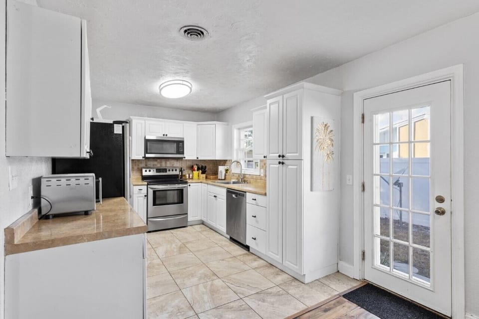 Spacious kitchen with granite counters and updated appliances

