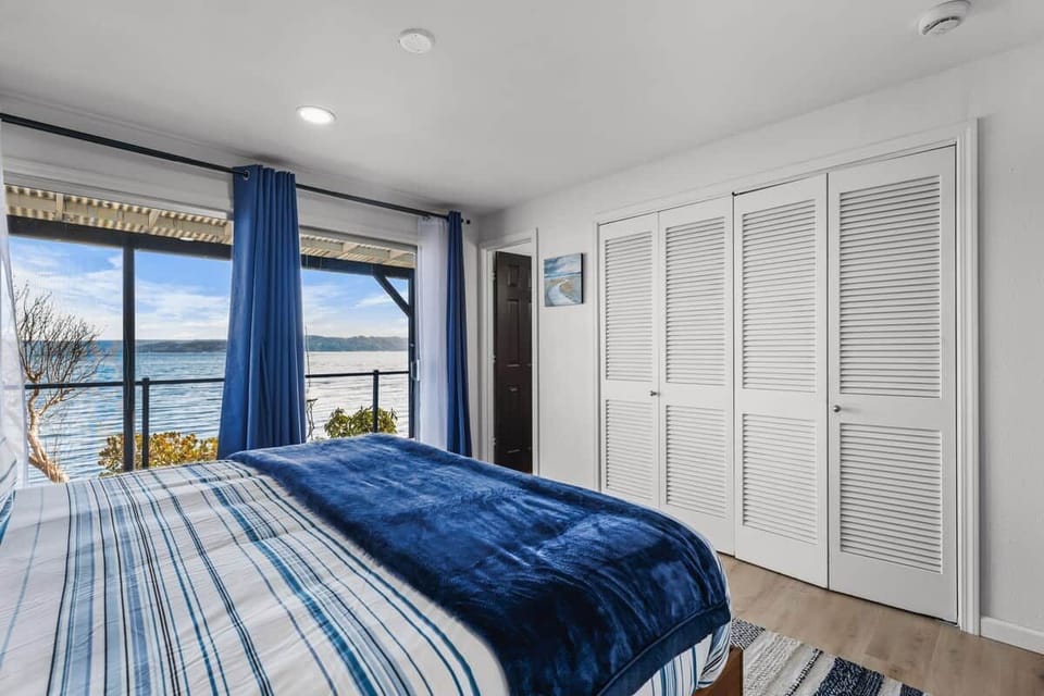 Master bedroom with sweeping views of the canal right from the King size bed. 