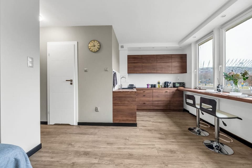 Living Room with Kitchen & Stunning National Stadium View | Book Now with RENTUJEMY.COM