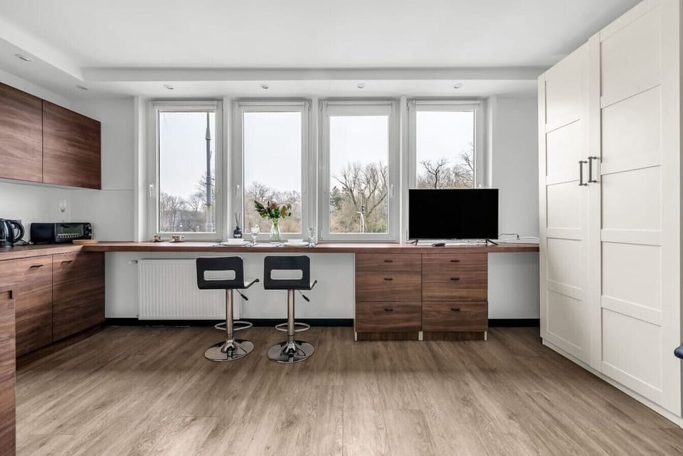 Living Room with Kitchen & Stunning National Stadium View | Book Now with RENTUJEMY.COM