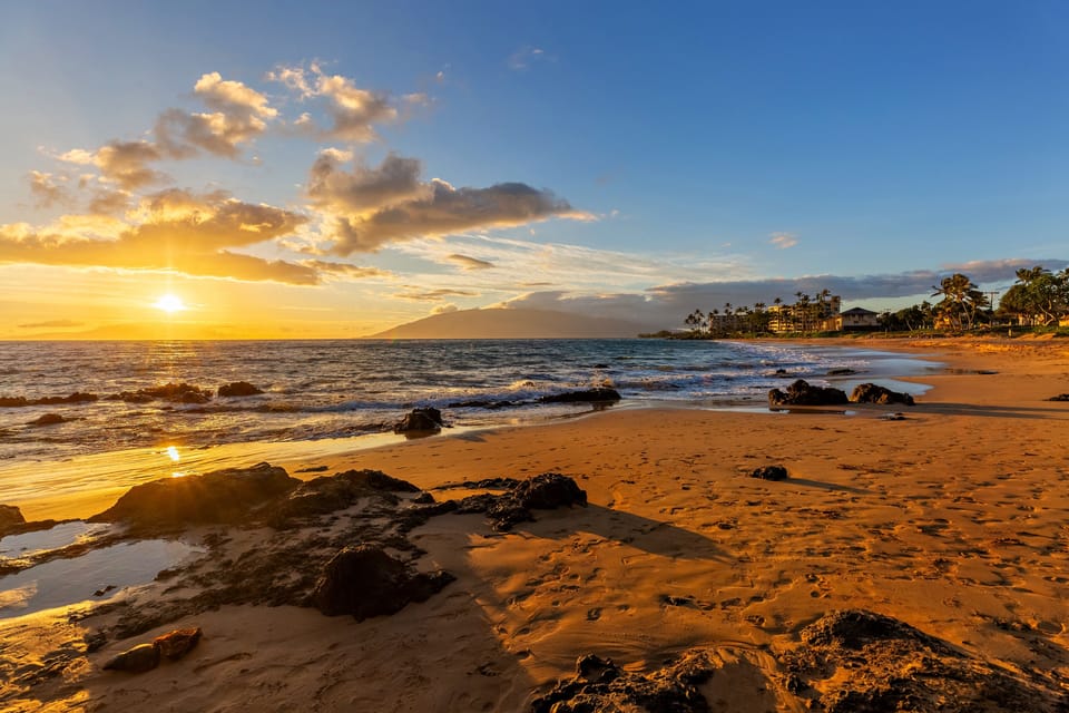 The sun sets over Kamaole Beach II, just across the street from Maui Banyan.