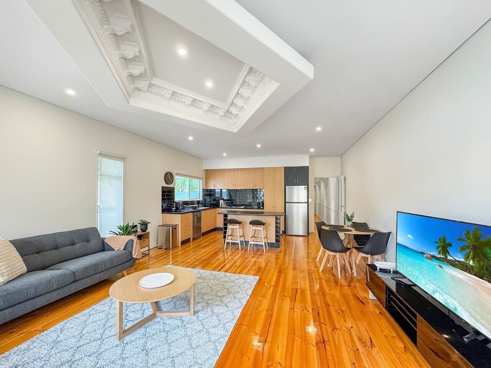 Living area with comfy couches, dining area & Smart TV