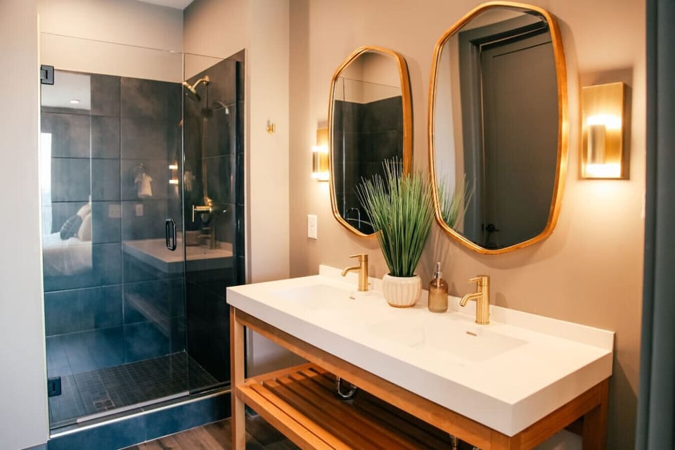 Bathroom with double vanity and walk in shower