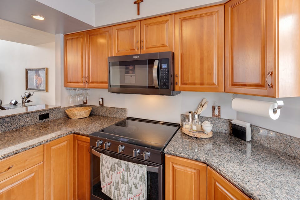 Kitchen boasts granite countertops and updated appliances.