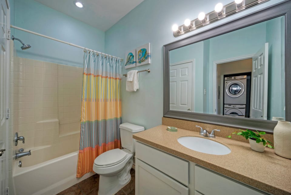 The ensuite bathroom features a shower/tub combo. (Costa Bahia 205)