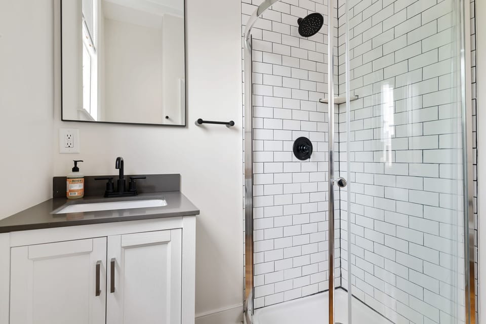 A space that invites deep breaths and longer showers.
