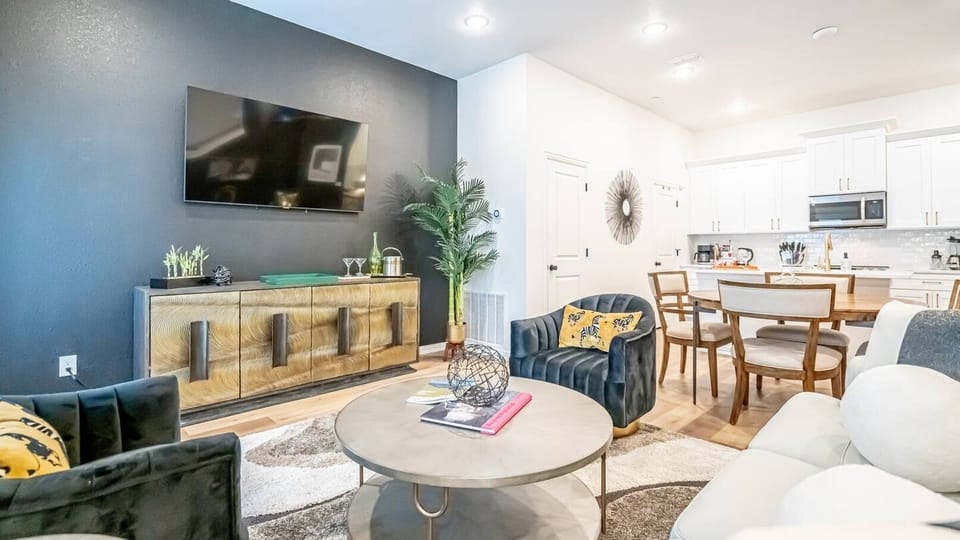 Kick back in a stylish, open-concept living space designed for comfort and connection. Whether you're debriefing after a Rangers game, watching pre-game coverage on the smart TV or just relaxing with your crew—The Ryan's living area has you covered.