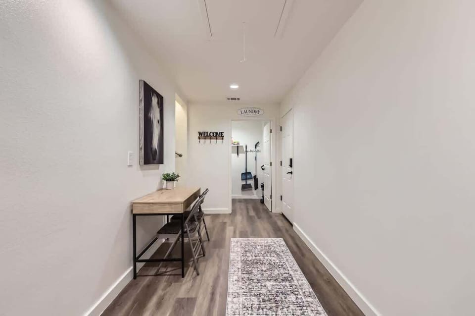 Spacious hallway with a functional desk area, perfect for catching up on work or planning your day