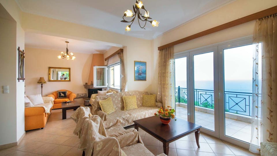Sunlit Sitting Area with Coastal Decor and Balcony Access
A cheerful corner perfect for reading, relaxing, or enjoying the view through large windows.