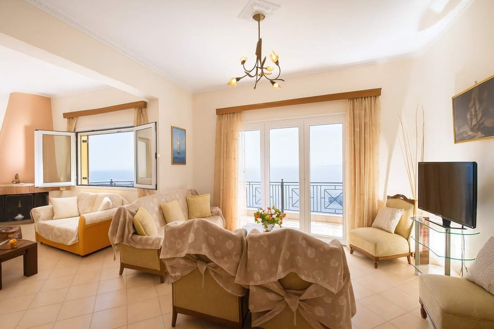 Bright and Elegant Living Room with Coastal Views
Comfortable seating, natural light, and sweeping views create a welcoming space to unwind.

