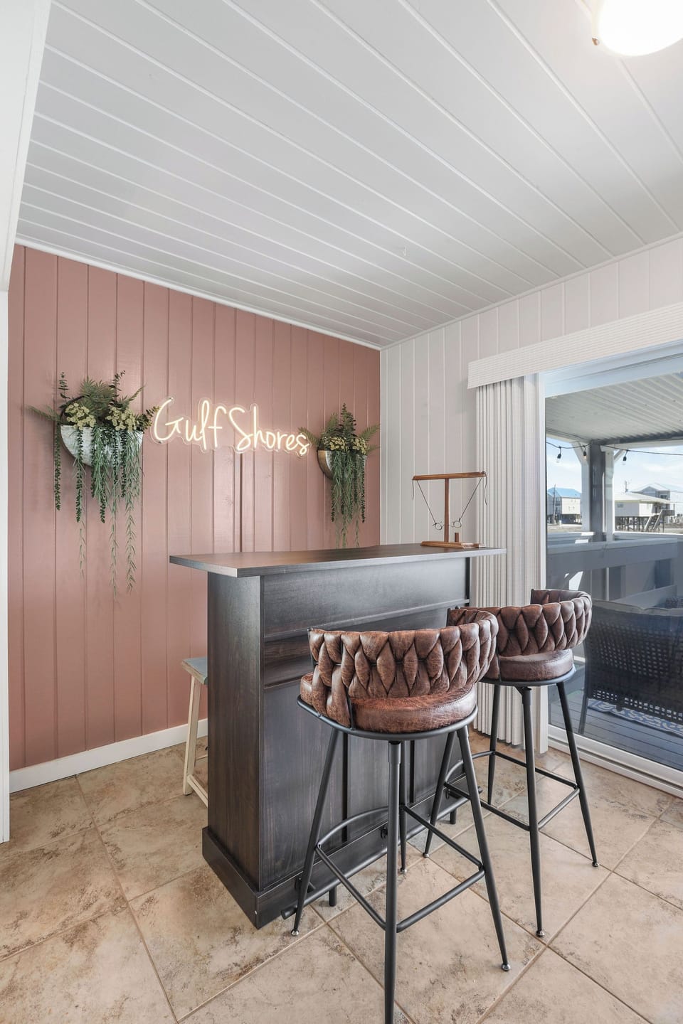 Feature wall in Game Room opens to covered back patio