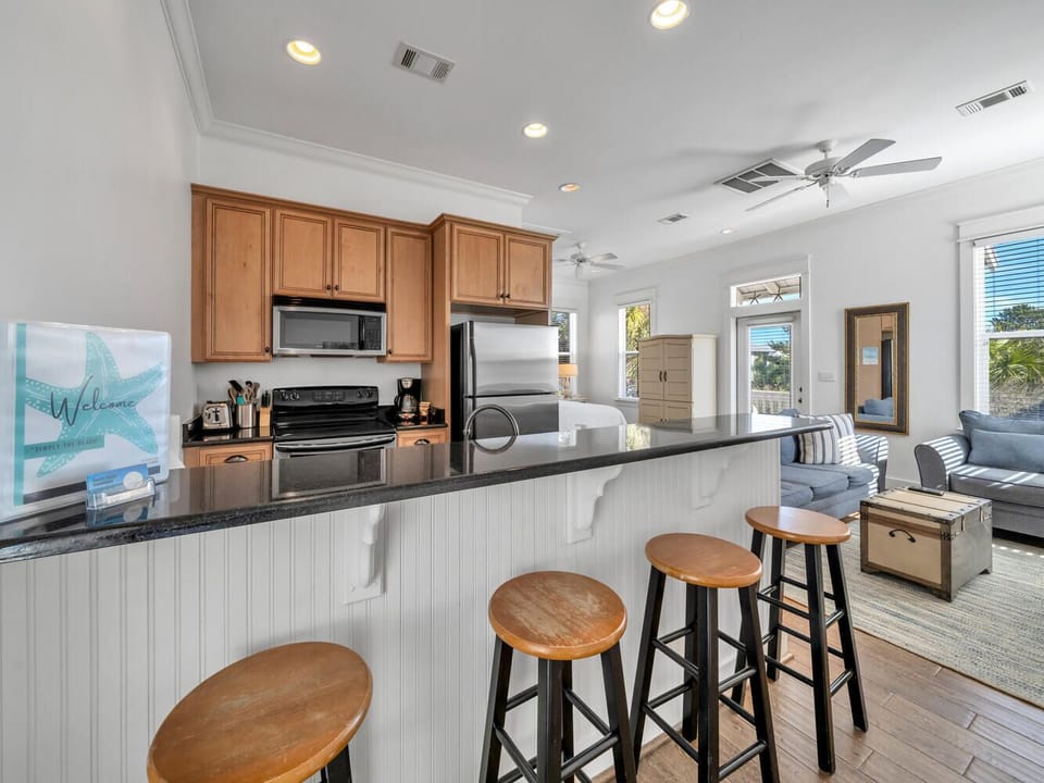 Your spacious kitchen flows into the living area, perfect for gathering while you cook and create vacation memories together.