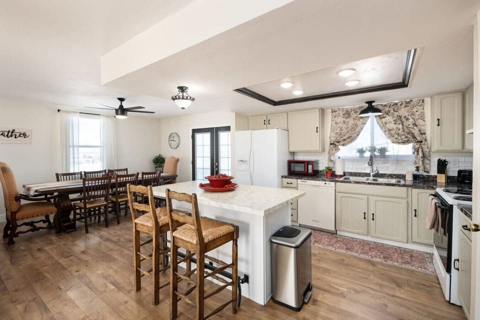 Fully equipped kitchen and dining area with seating for family meals and open access to the living space—perfect for group stays.