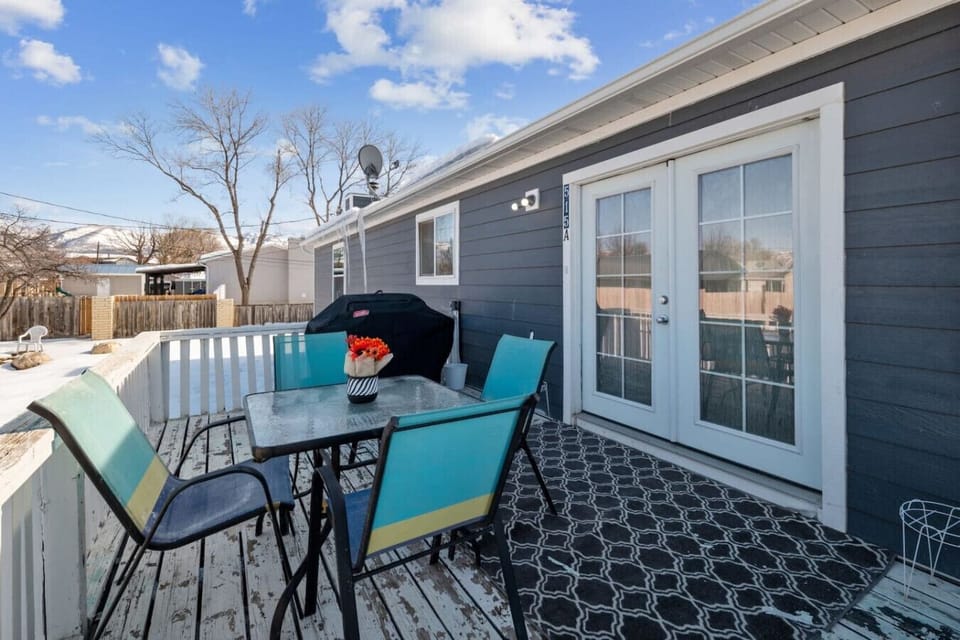 Spacious outdoor deck with BBQ grill and dining table—perfect for family cookouts and sunset dinners.