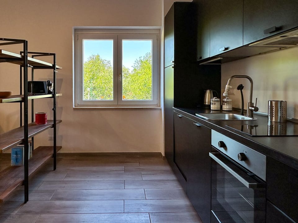 Apartment, Courtyard View | Private kitchen | Espresso maker, coffee/tea maker, electric kettle