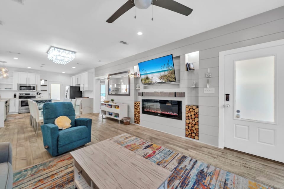 Living room with flat screen TV and fireplace
