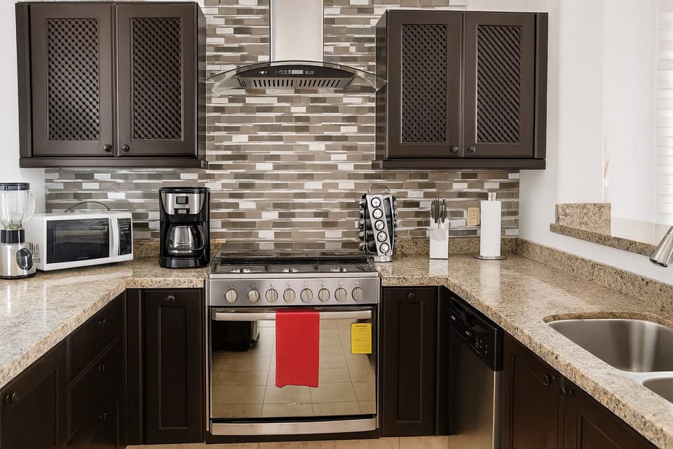 Premium Villa, Partial Ocean View | Private kitchen | Coffee/tea maker, highchair, dining table