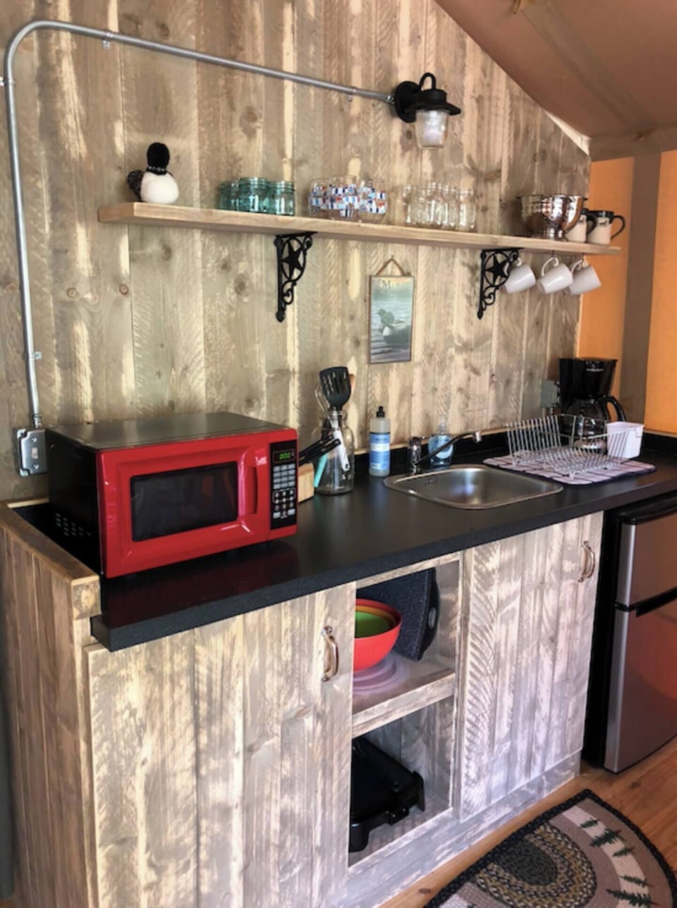Mini-fridge, microwave, coffee/tea maker, cookware/dishes/utensils