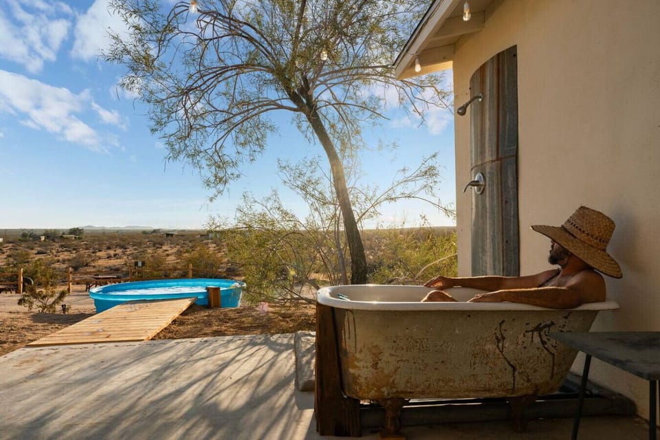A glowing desert cottage, a vintage trailer, and a sky packed with stars. Straight out of a Joshua Tree fairy tale. 🌟🌵