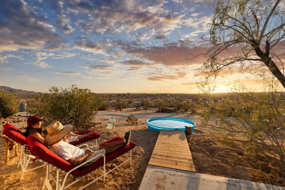 Elevated deck, pool, hot tub, and a sunset that performs every night