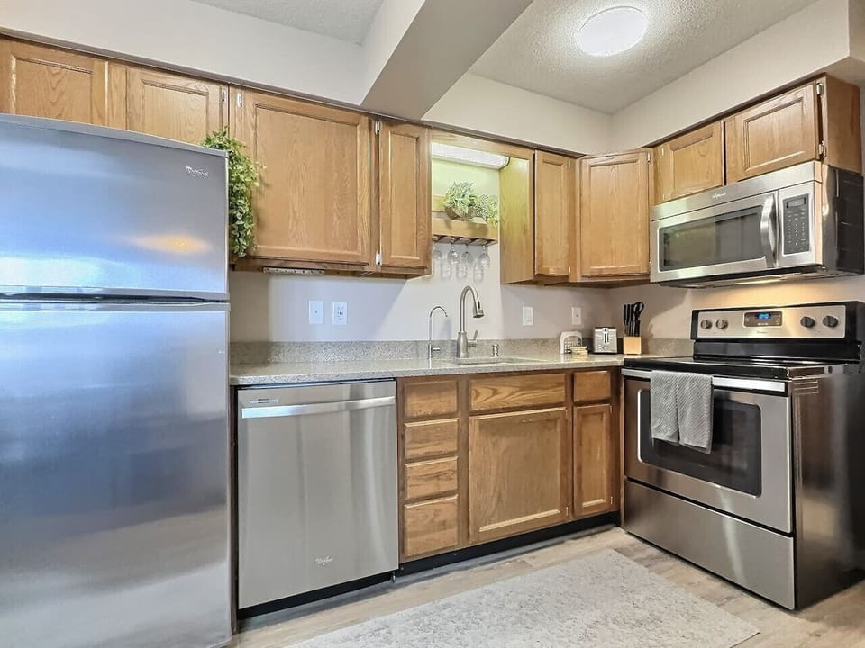 Prepare meals with ease in this fully equipped kitchen.